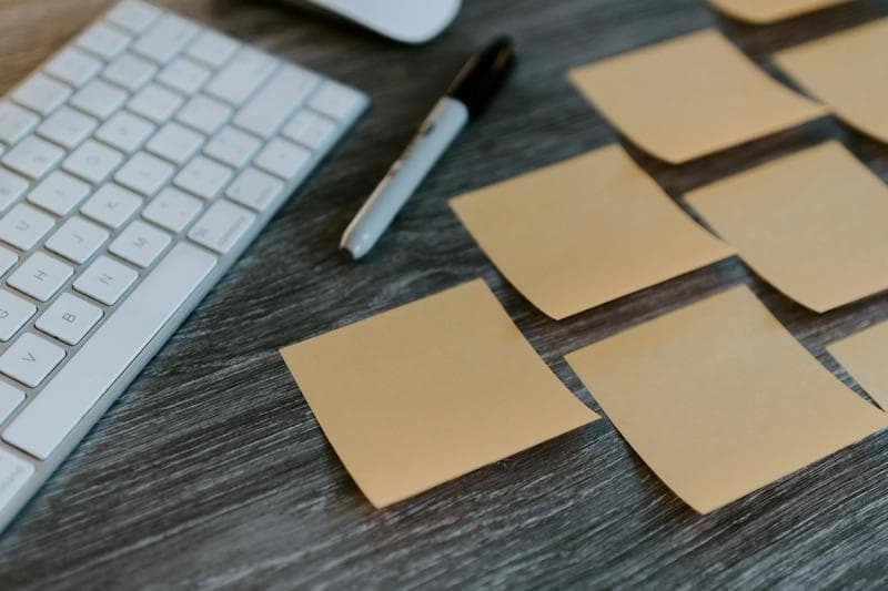 sticky notes with laptop -  How To Manage Email Subscriptions