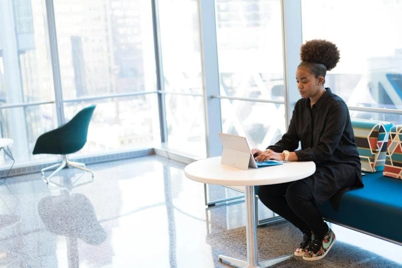 woman working on laptop - Email Management Software