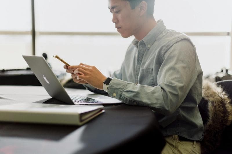 man looking at his inbox - Email Management Strategies